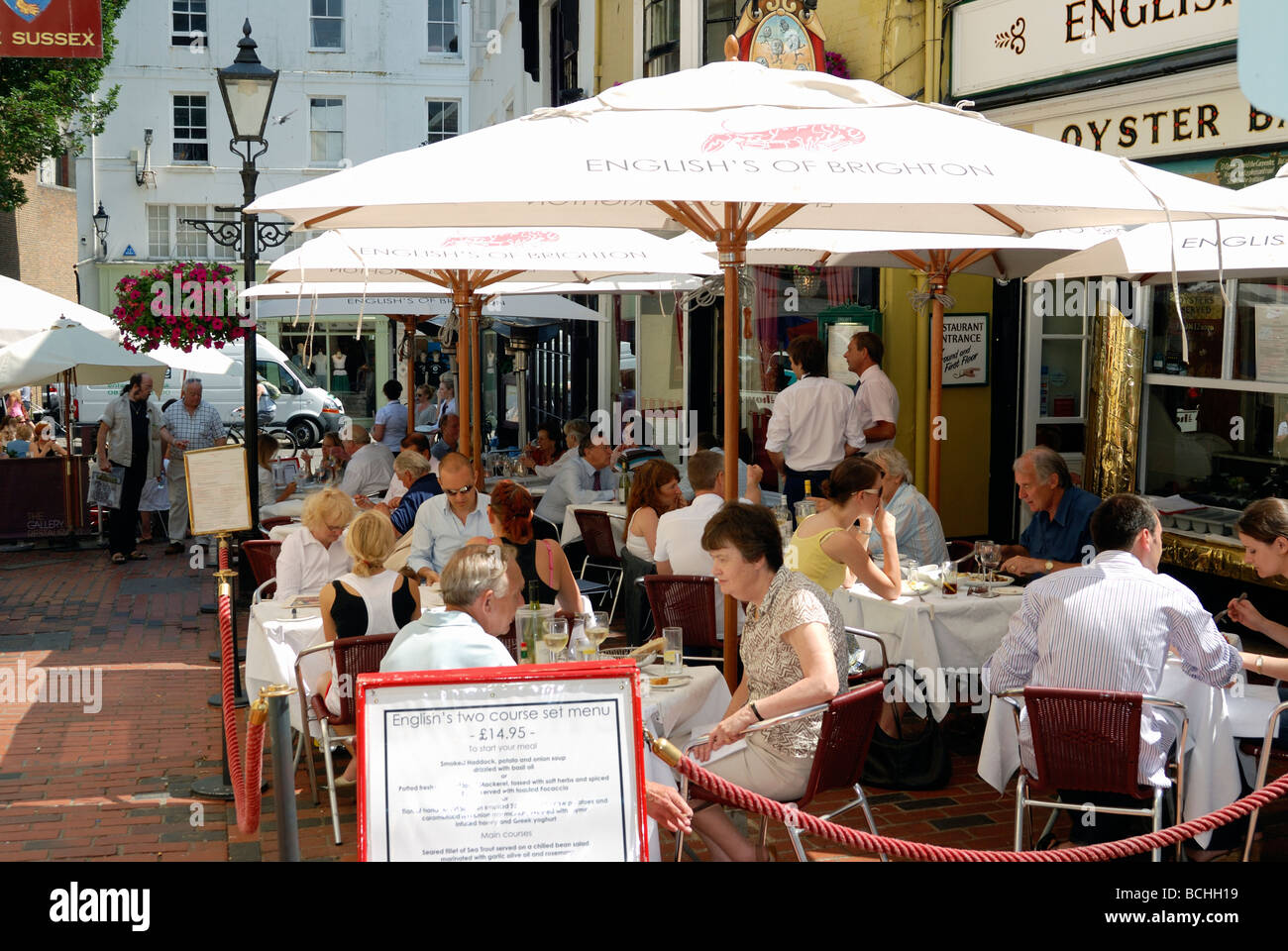 Diners sitting outside a restaurant Stock Photo