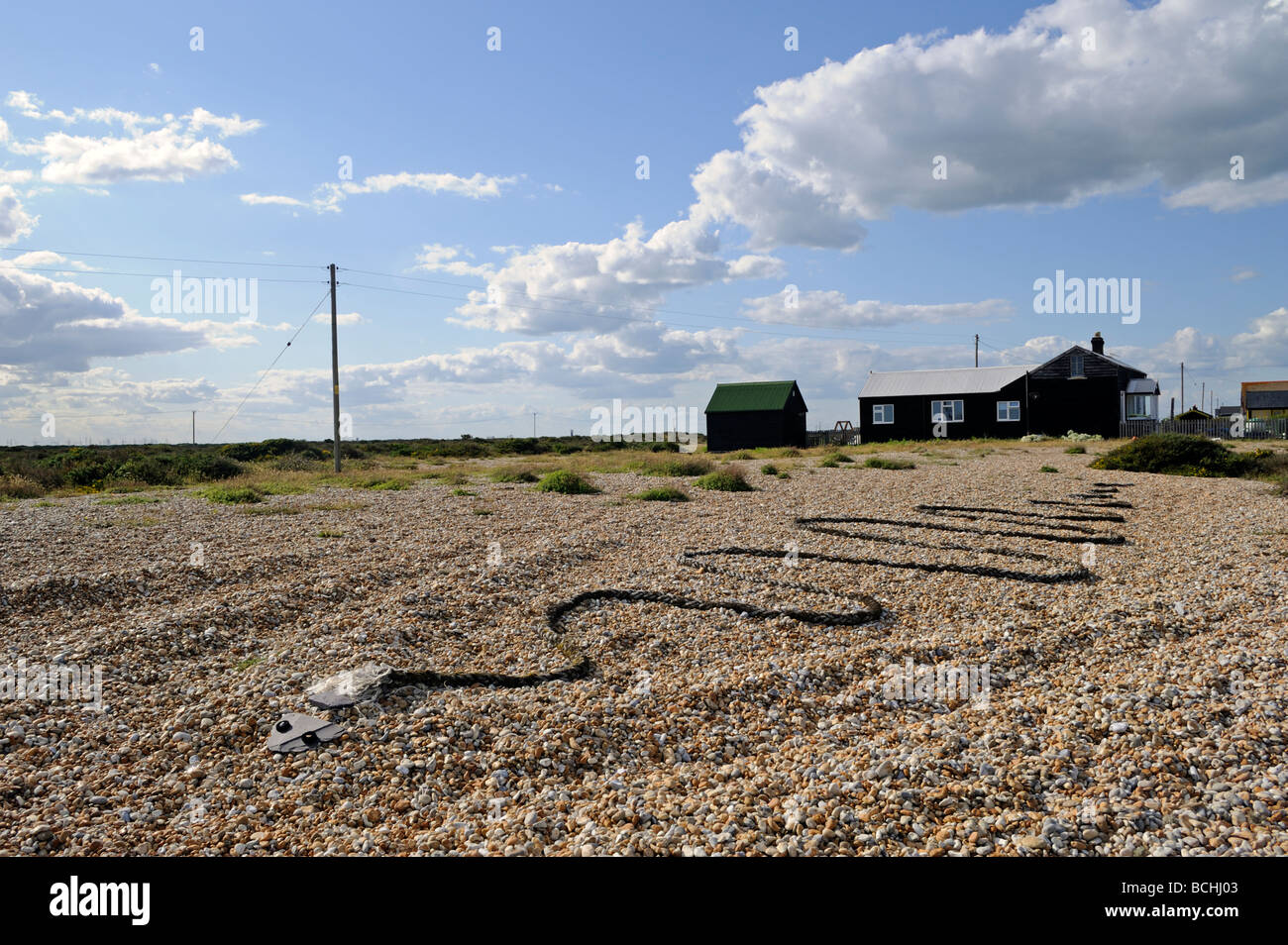Rope snake sculpture on shingle beach Dungeness Kent,UK Stock Photo