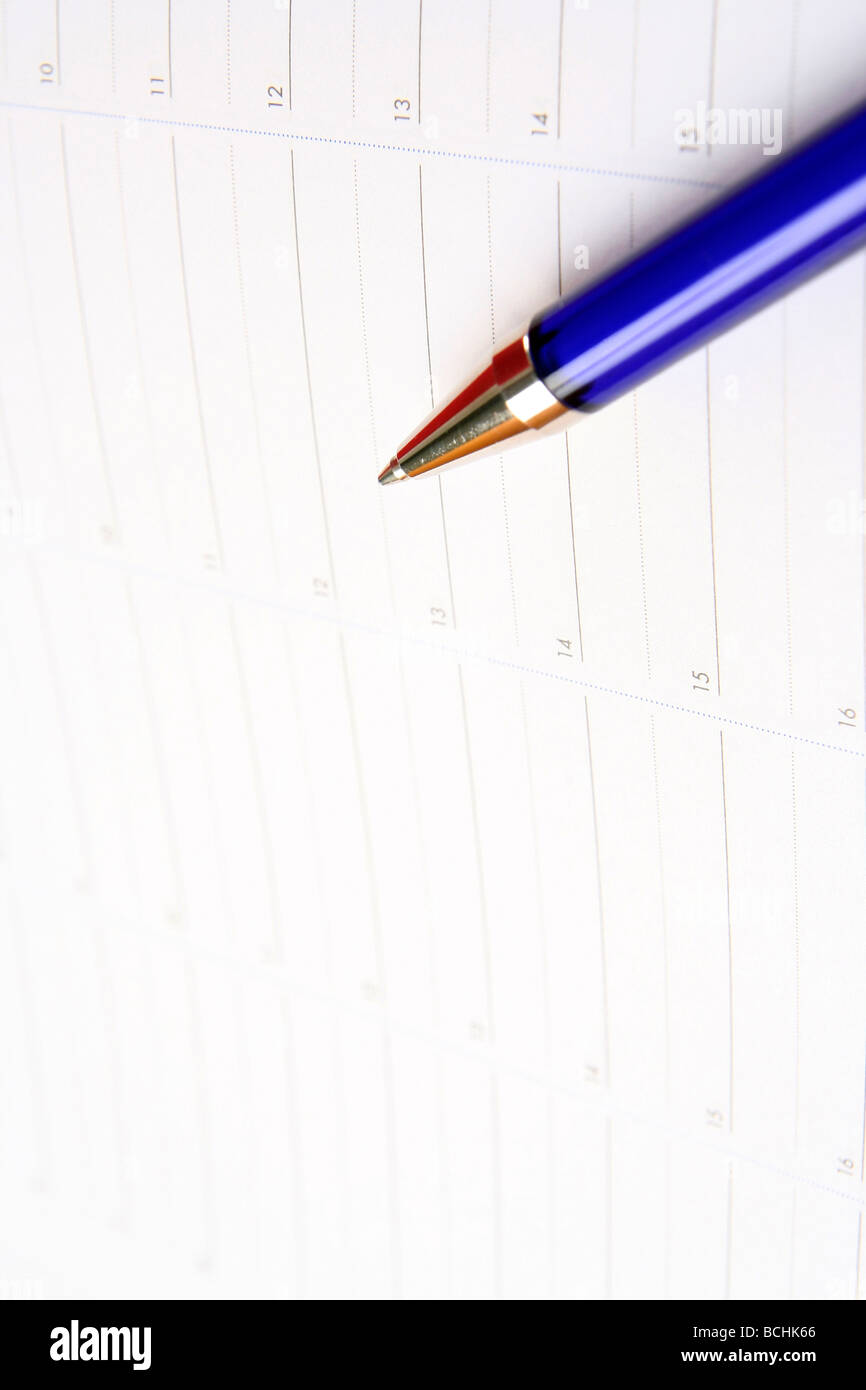 Close-up of color pencils and agenda Stock Photo