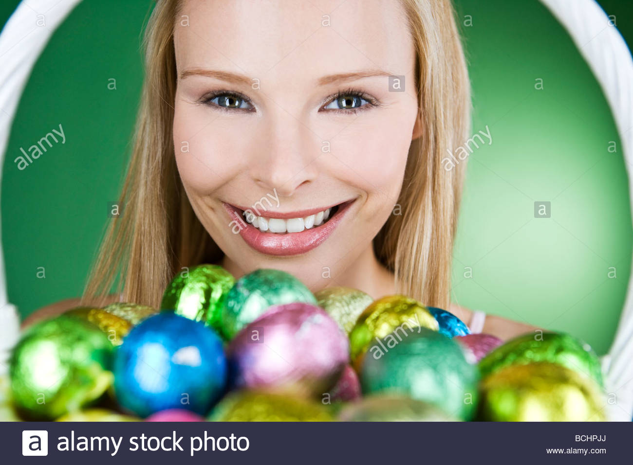 A Young Woman Holding Basket Of Easter Eggs