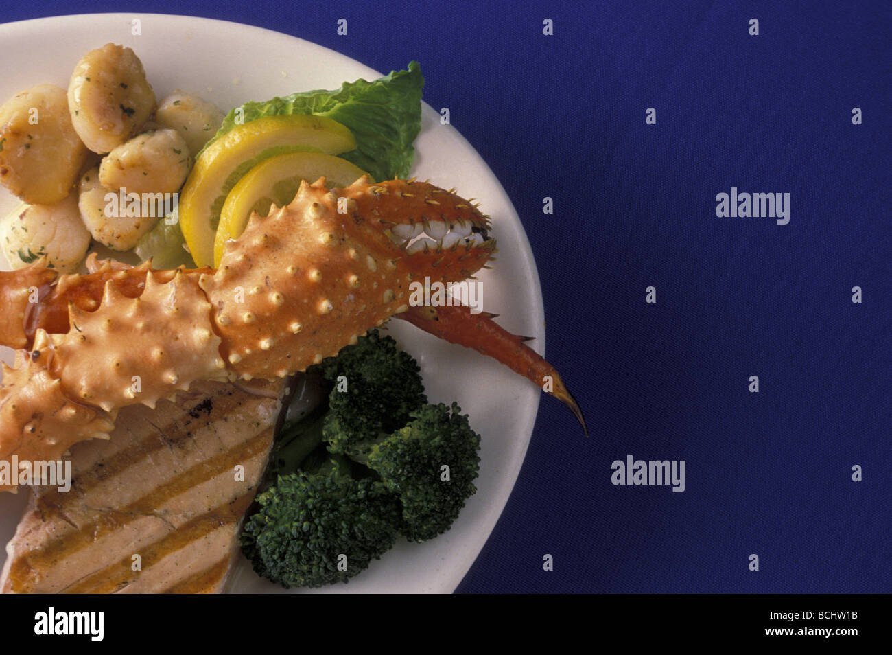 AK Seafood Dish Grilled Salmon King Crab Scallops/nStill Life Alaska Stock Photo
