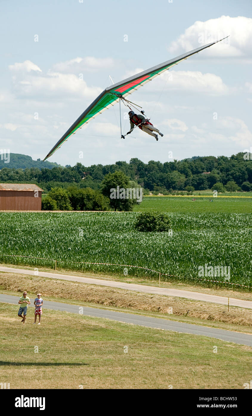 Hang glider coming in to land at an airshow in France Stock Photo