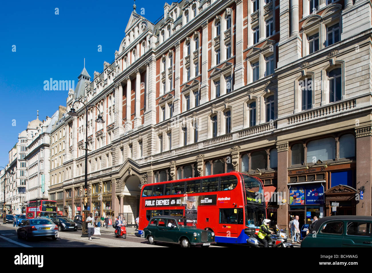 Traffic and pedestrians on The Strand WC2 London United Kingdom Stock Photo