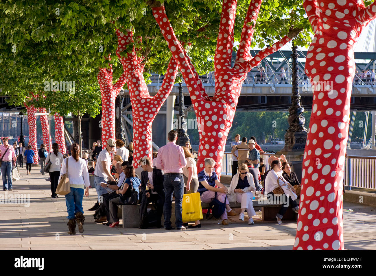 Trees covered in polka dots to celebrate exhibition by Yayoi Kusama at Hayward Gallery Southbank Centre London United Kingdom Stock Photo