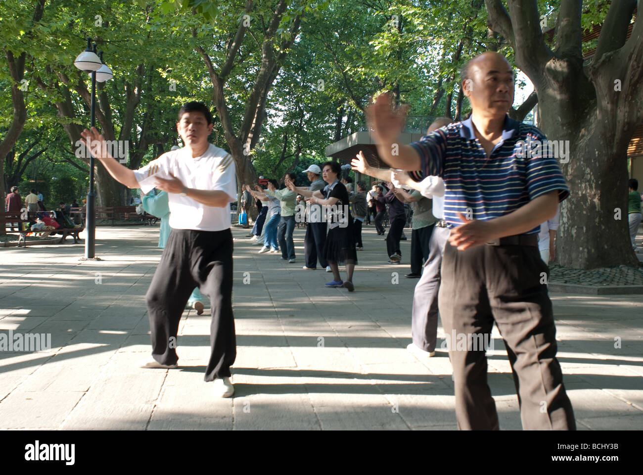 Group of people taking part in Tai Chi exercise at Fuxing Park Shanghai CHina Stock Photo