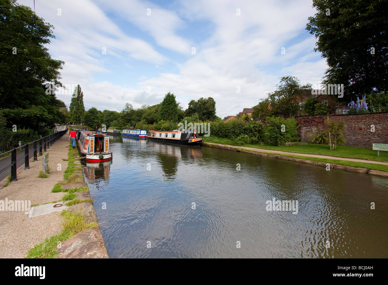 Canal and boats in Lymm, Warrington, Cheshire, England Stock Photo