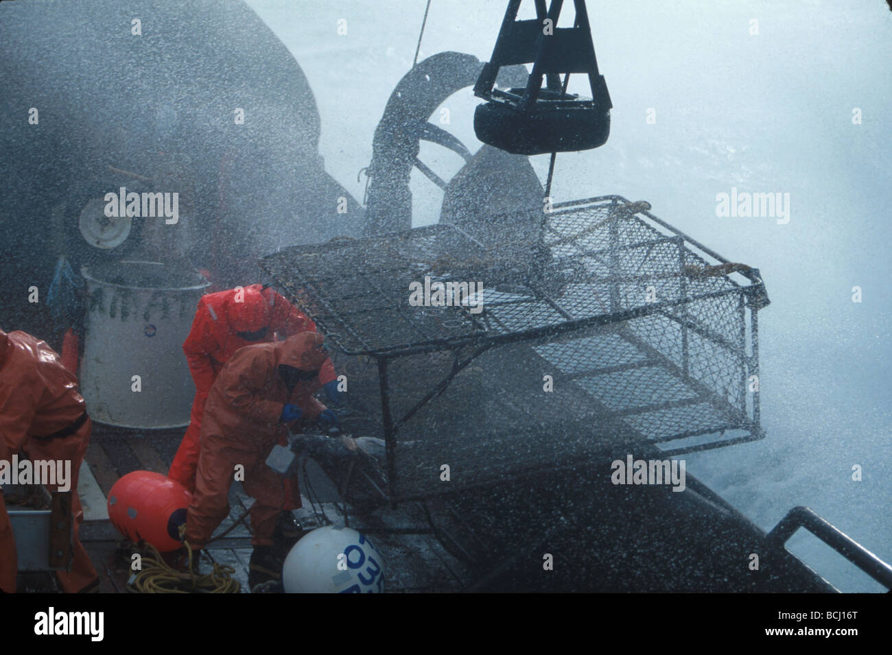 Fisherman Launches Crab Pot Bering Sea SW AK/nf/v Amatuli Stock Photo