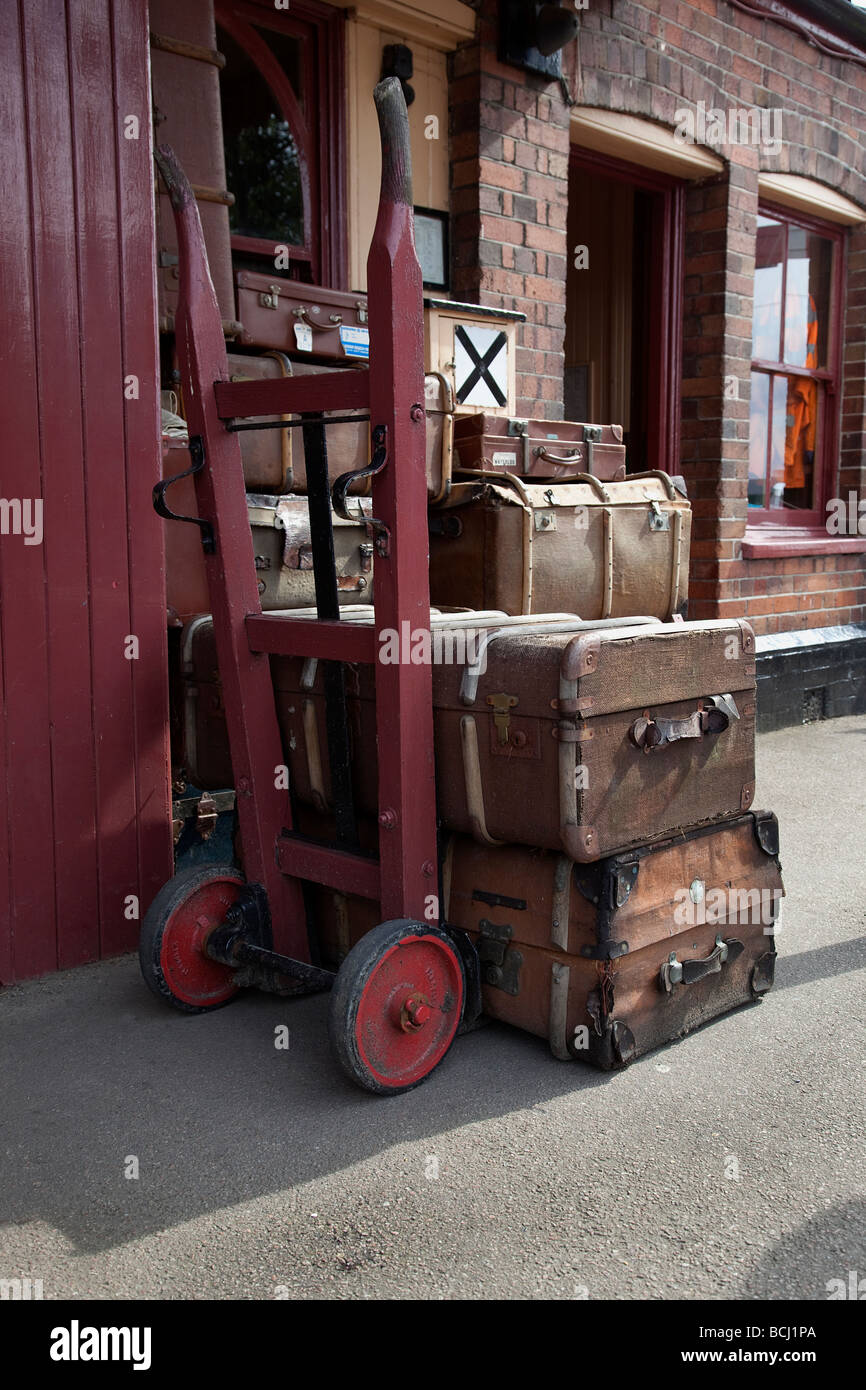 Porter s luggage barrow at railway station Stock Photo