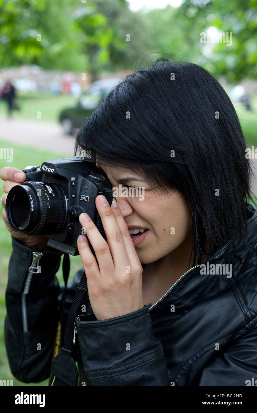 Portrait Of An Amateur Photographer Holding A Digital Camera - 