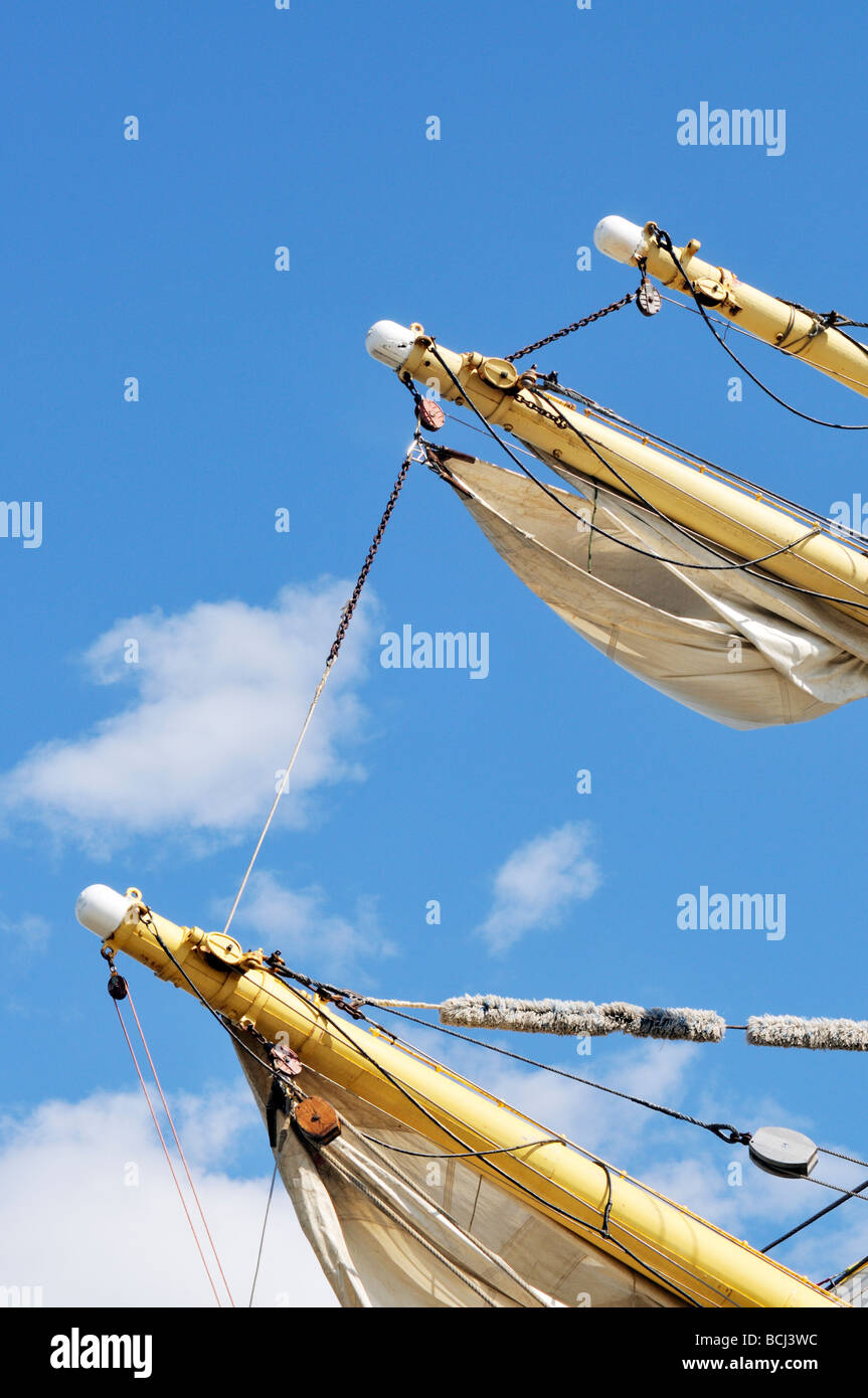 Tall ship yardarm with furled sail and block and tackle Stock Photo