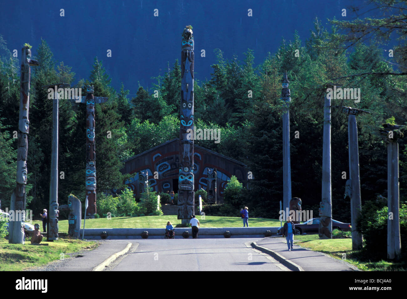 Totem poles and community House at Saxman totem park near Ketchikan ...