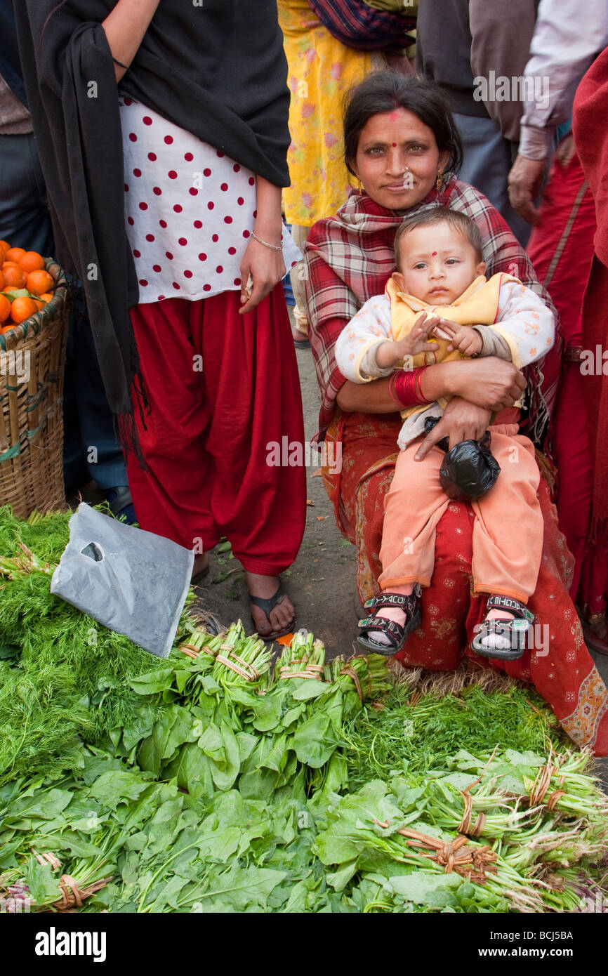 Kathmandu, Nepal. Micro credit Loan Recipient Poses in the Market with her Son. Stock Photo