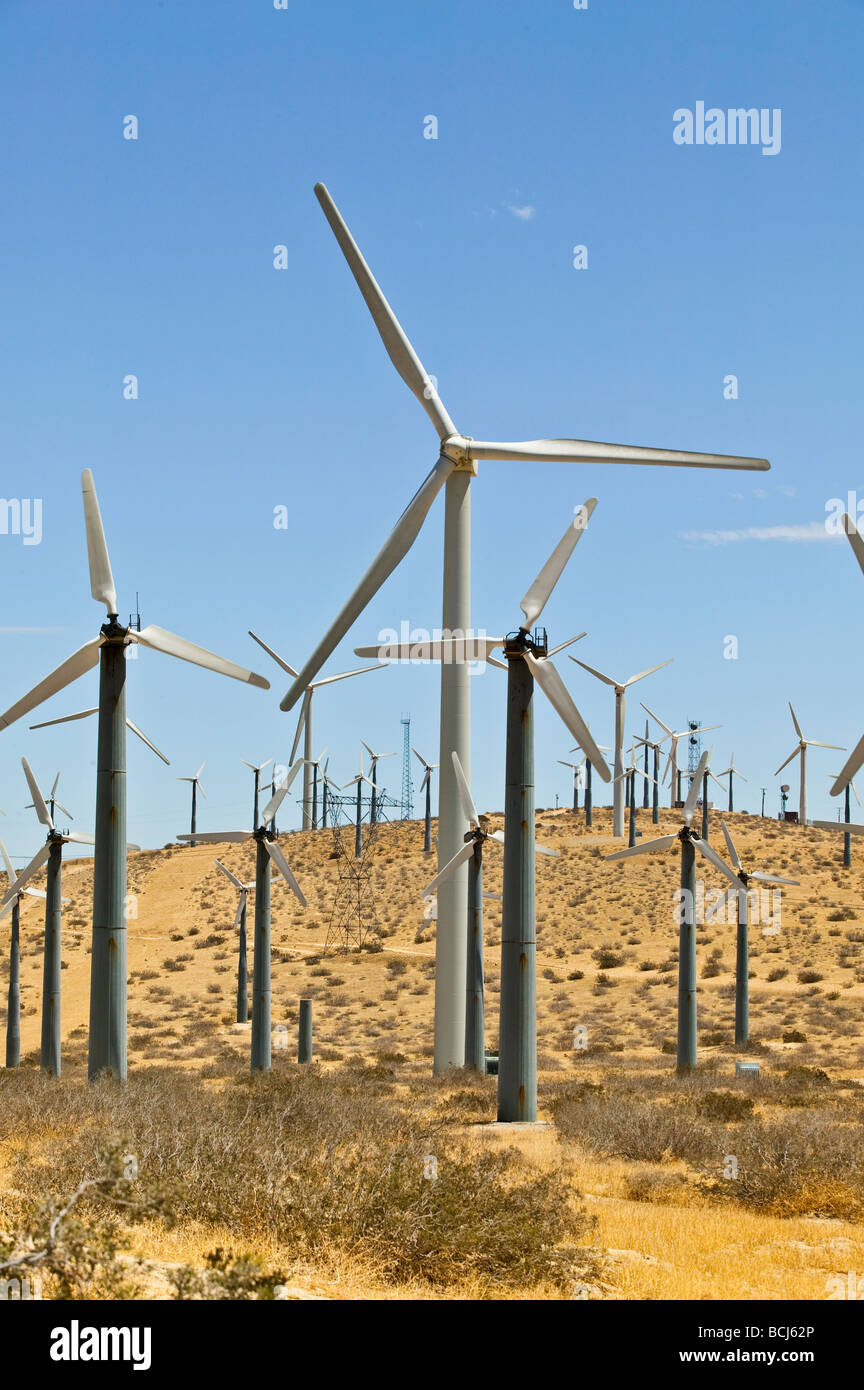 Energy generating windmills on desert hill against sky Palm Springs California USA Coachella Valey Stock Photo