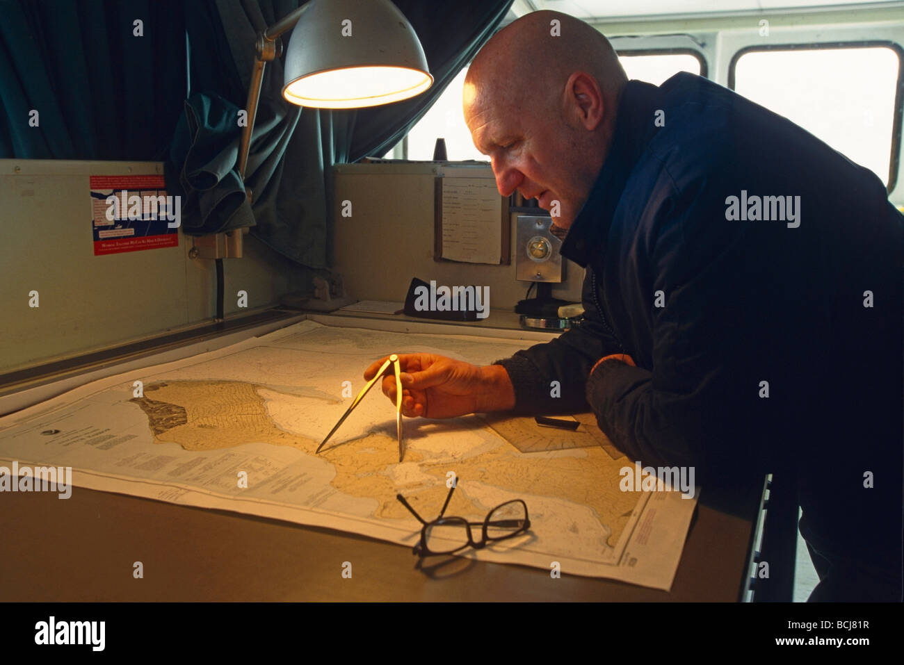 Sealand second mate plotting course Dutch Harbor SW AK Aleutian Islands portrait Stock Photo