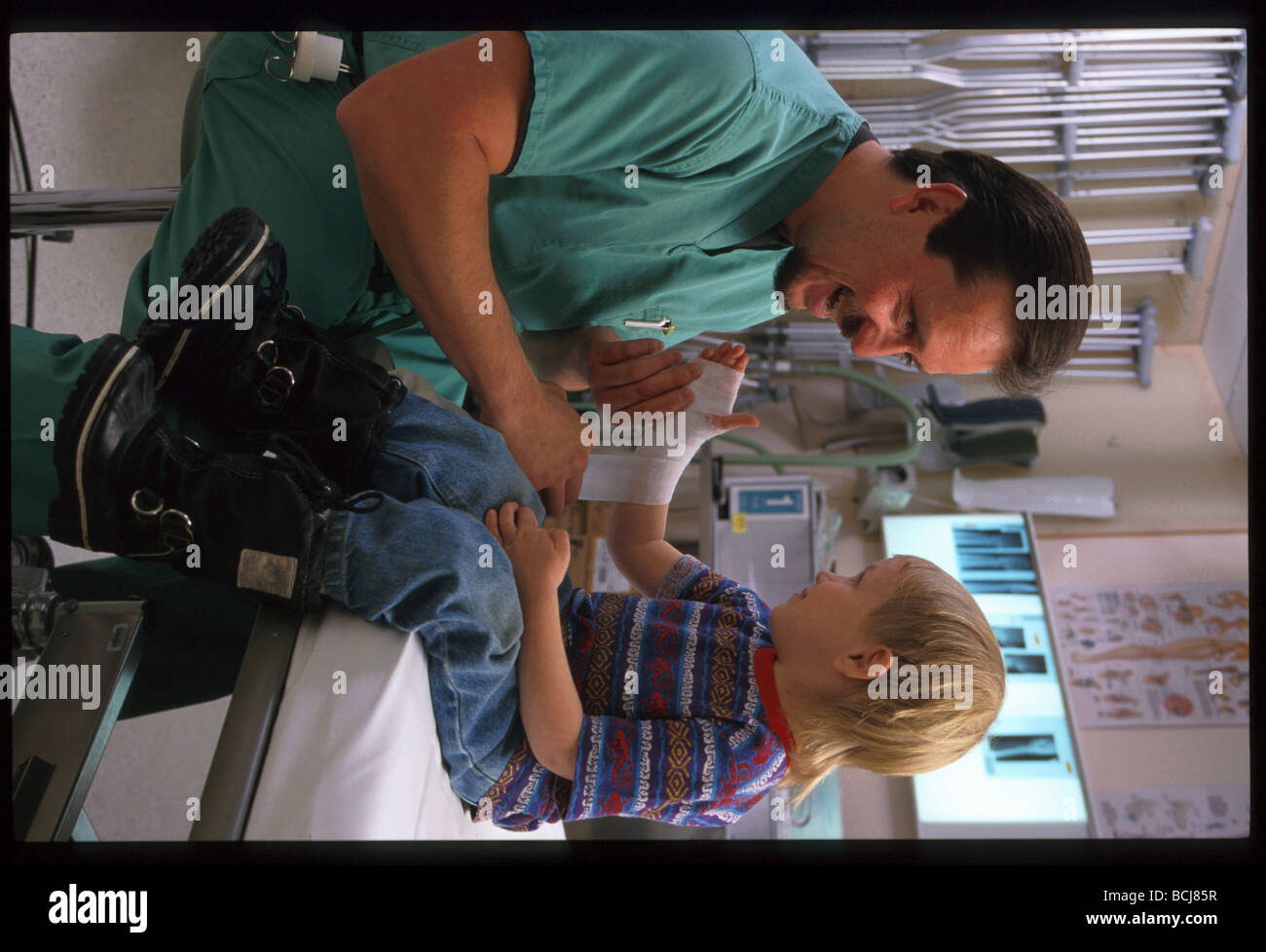 Doctor Bandaging Injured Boy AK Regional Hospital SC AK Stock Photo