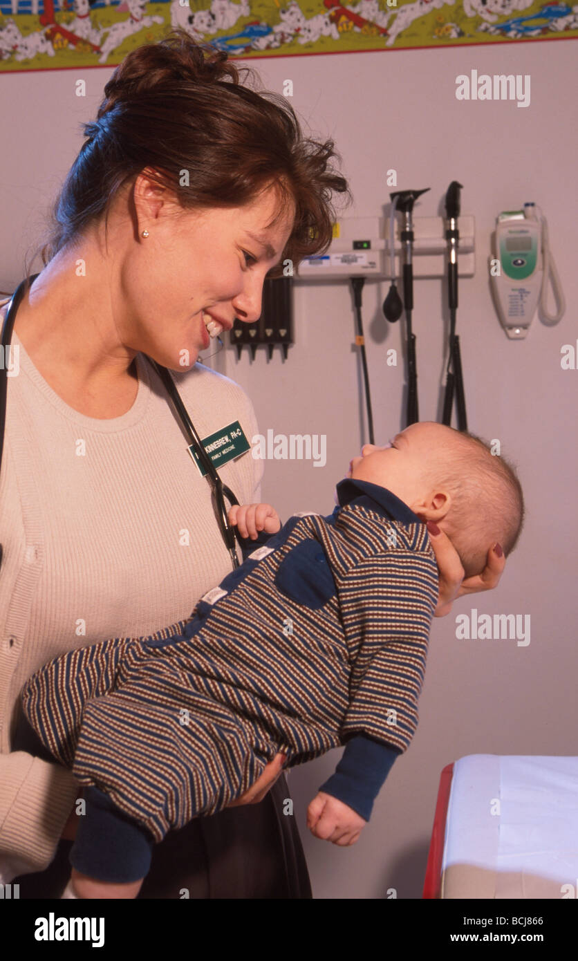Female Doctor W/Native Baby Boy at Health Clinic SC AK Stock Photo