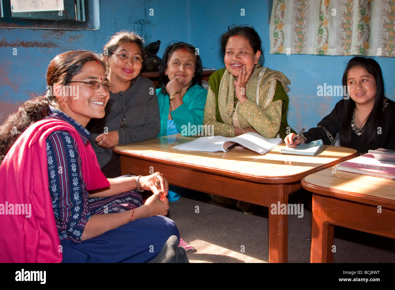 Kathmandu, Nepal.  Micro-credit Loan Recipient Meets with Local Committee Supervising her Loan. Stock Photo