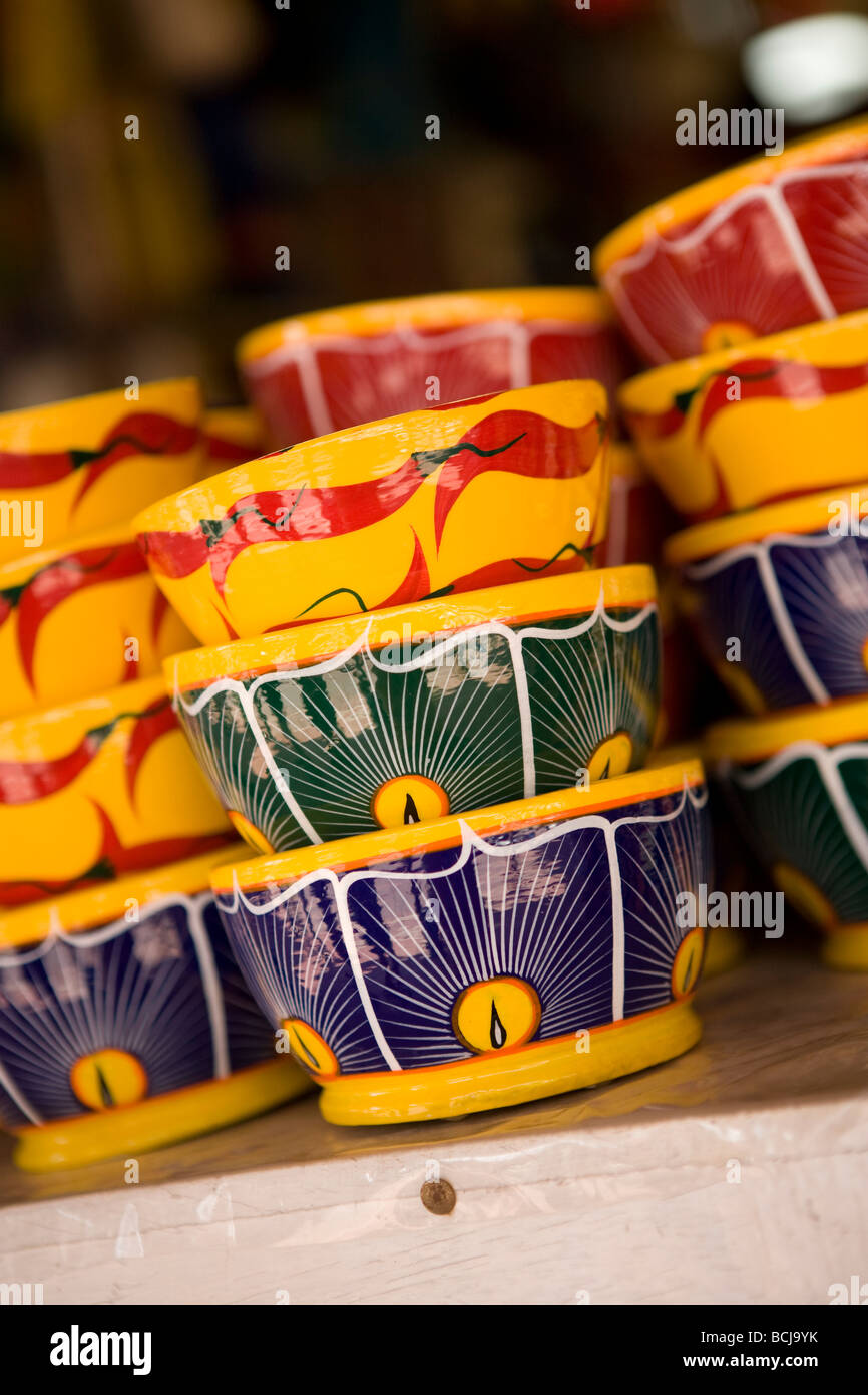 Zihuatanejo Mexico Stacks of multi colored painted bowls on display at street vendor Stock Photo