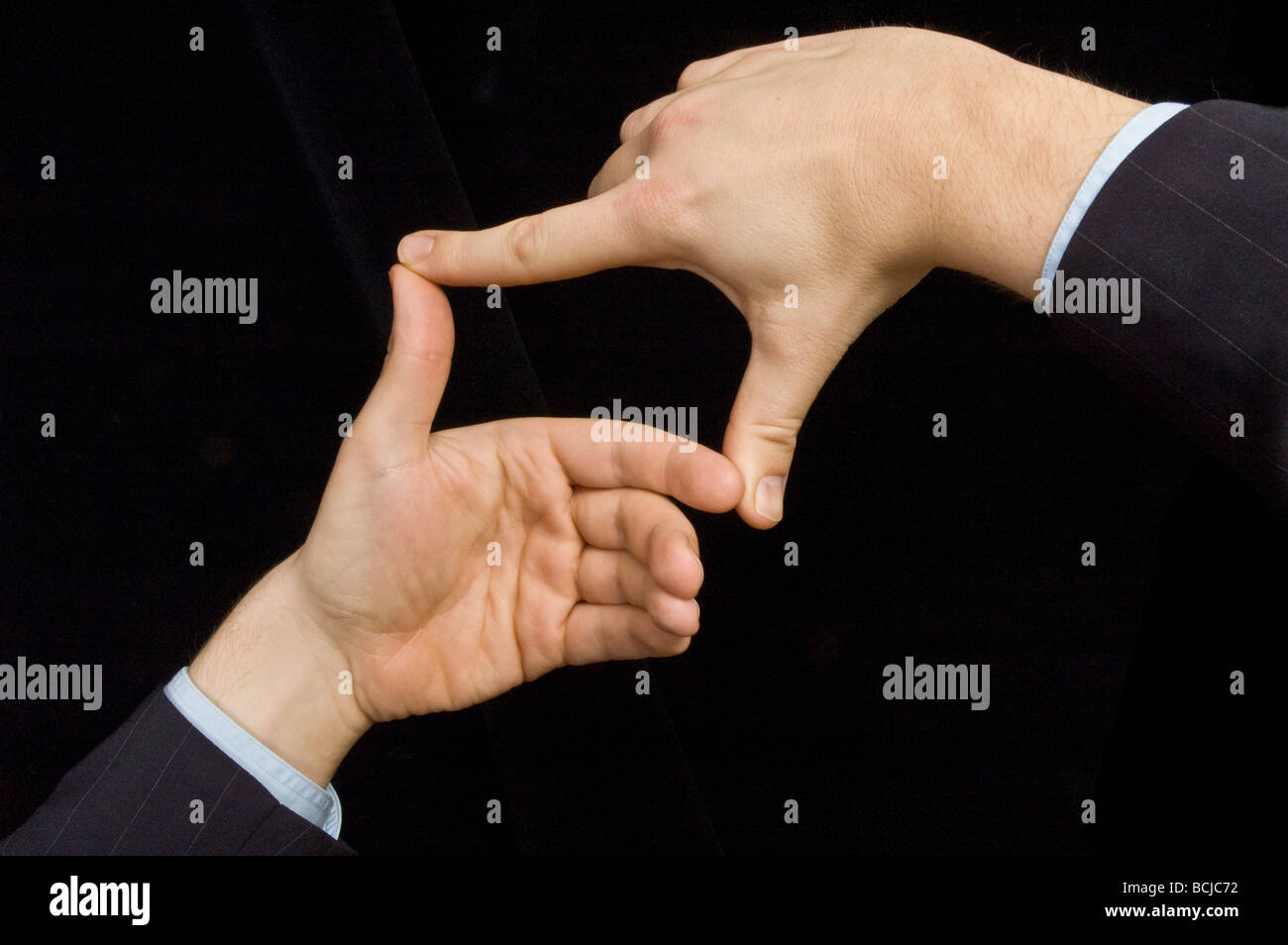 male hands against black Stock Photo