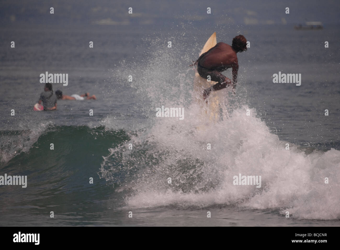 Surfing body board ocean sea riding baby fun sport Bali Kuta swimming