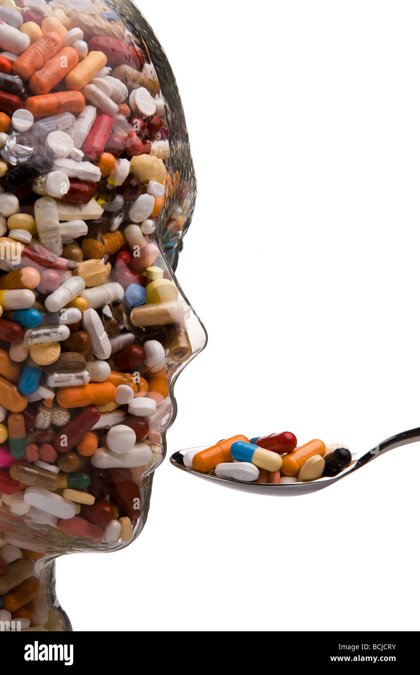 Tablets in head made of glass Stock Photo Alamy