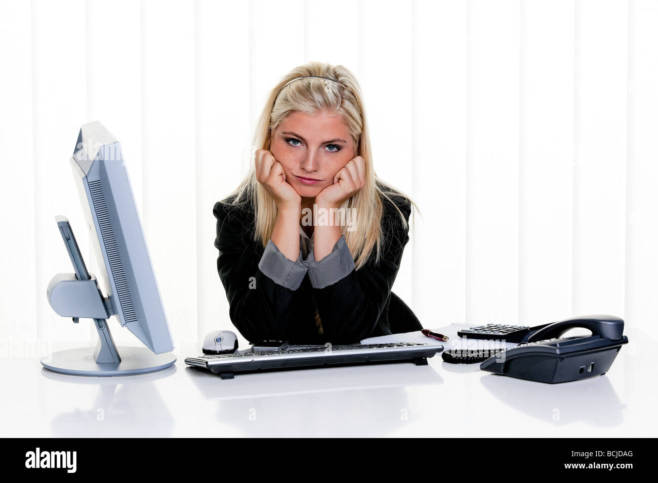 young stressed woman with problems in office Stock Photo