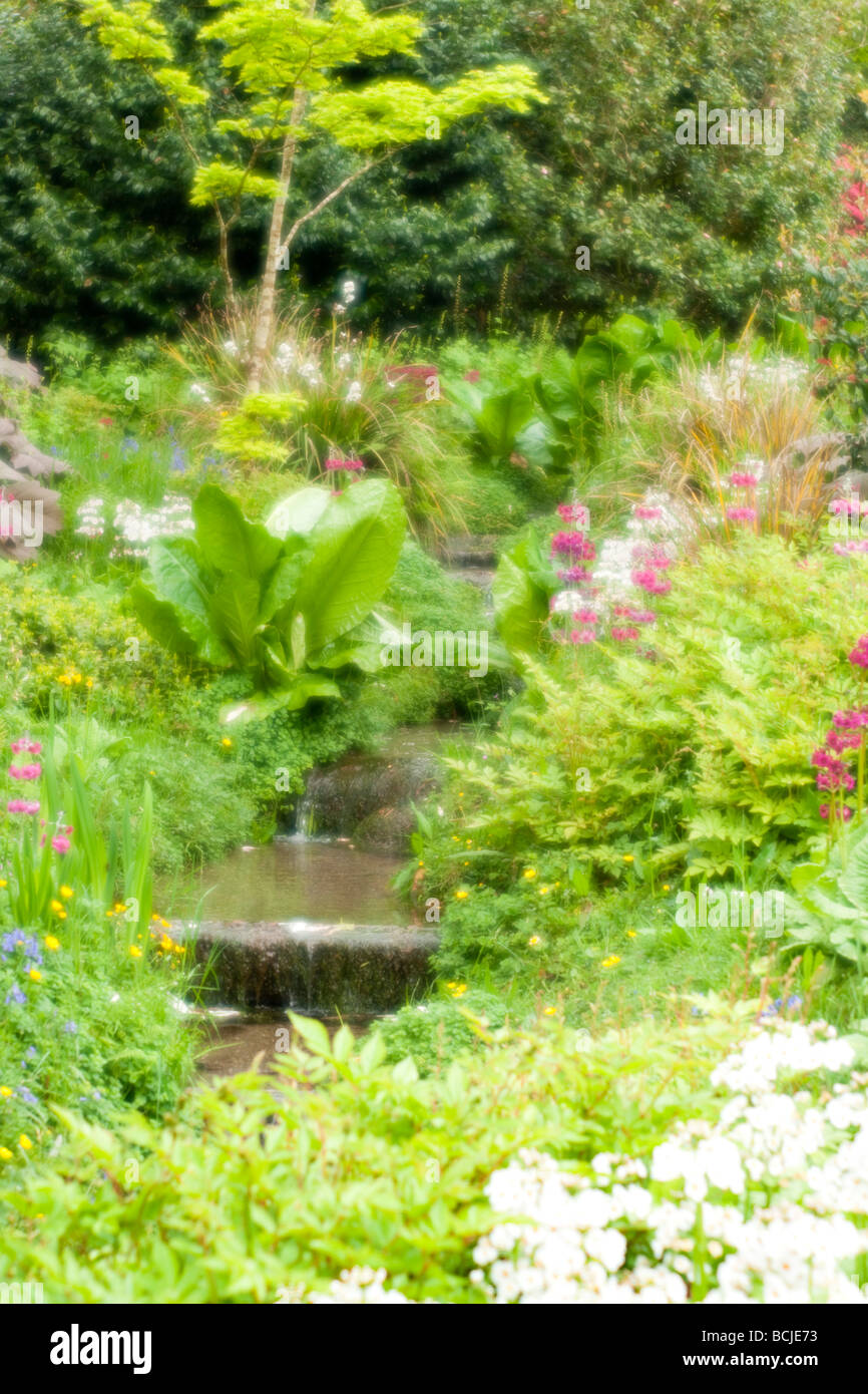 Garden and stream in soft focus Stock Photo