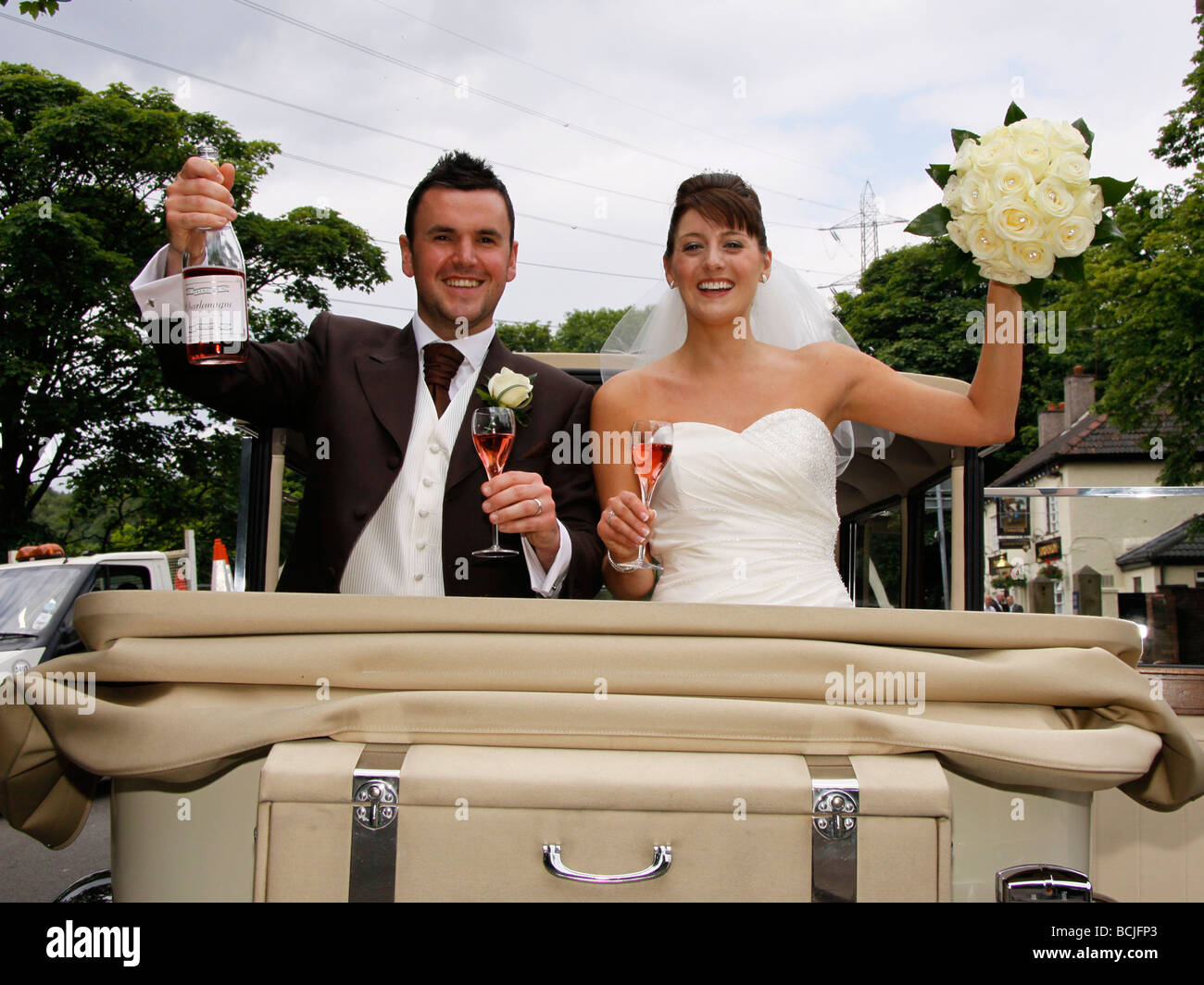Bride and Groom off on honeymoon after their wedding Stock Photo Alamy