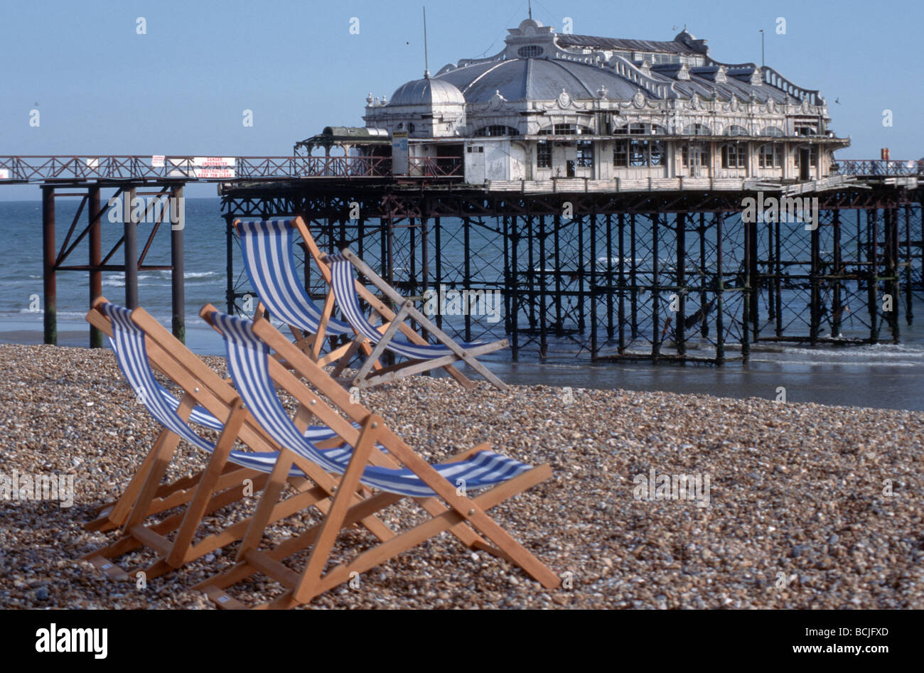 Brighton pier and Brighton Beach england uk great britain, and beach chairs low tide Stock Photo