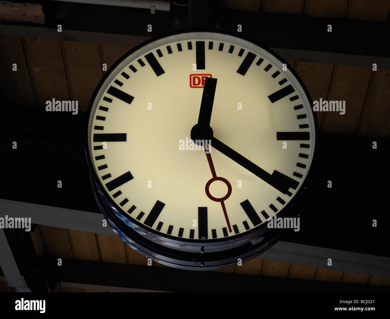 Germany Berlin Big train clock hanging under the ceiling March 09 Stock Photo