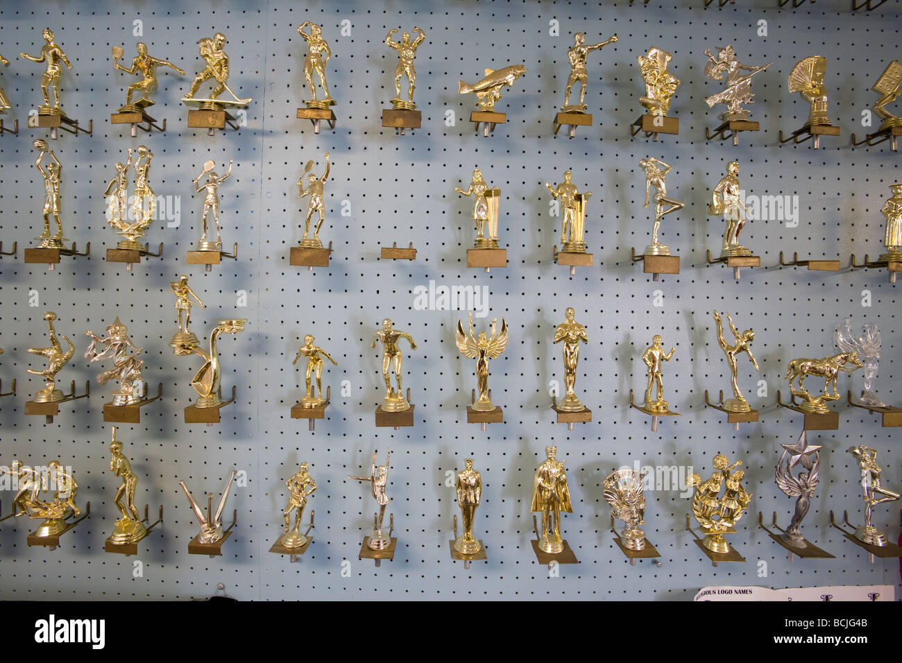 Display rack showing metal figurines used in trophy statues Stock Photo