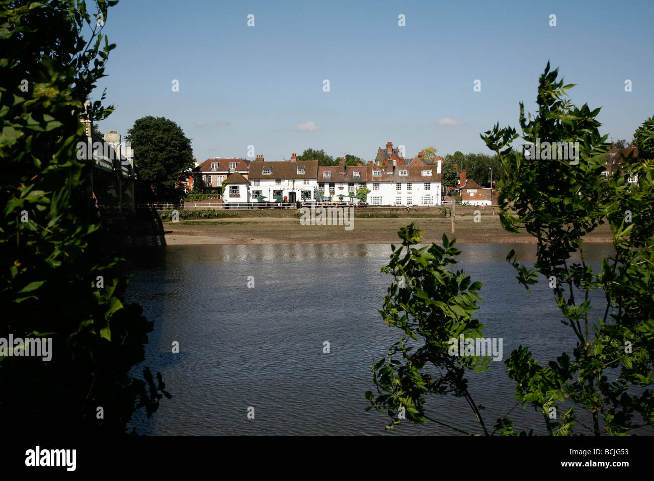 View across the River Thames to the Bull's Head pub, Strand on the Green, London, UK Stock Photo
