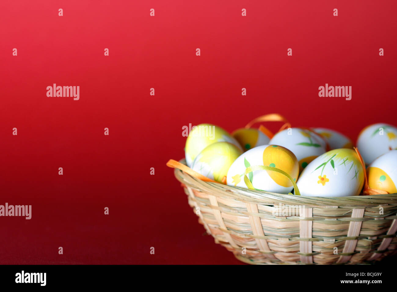 Painted easter eggs in basket Stock Photo - Alamy
