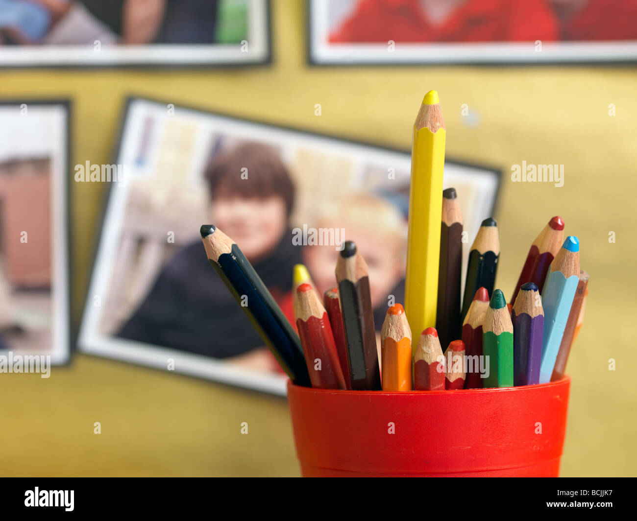 colored pencils in school pots Stock Photo