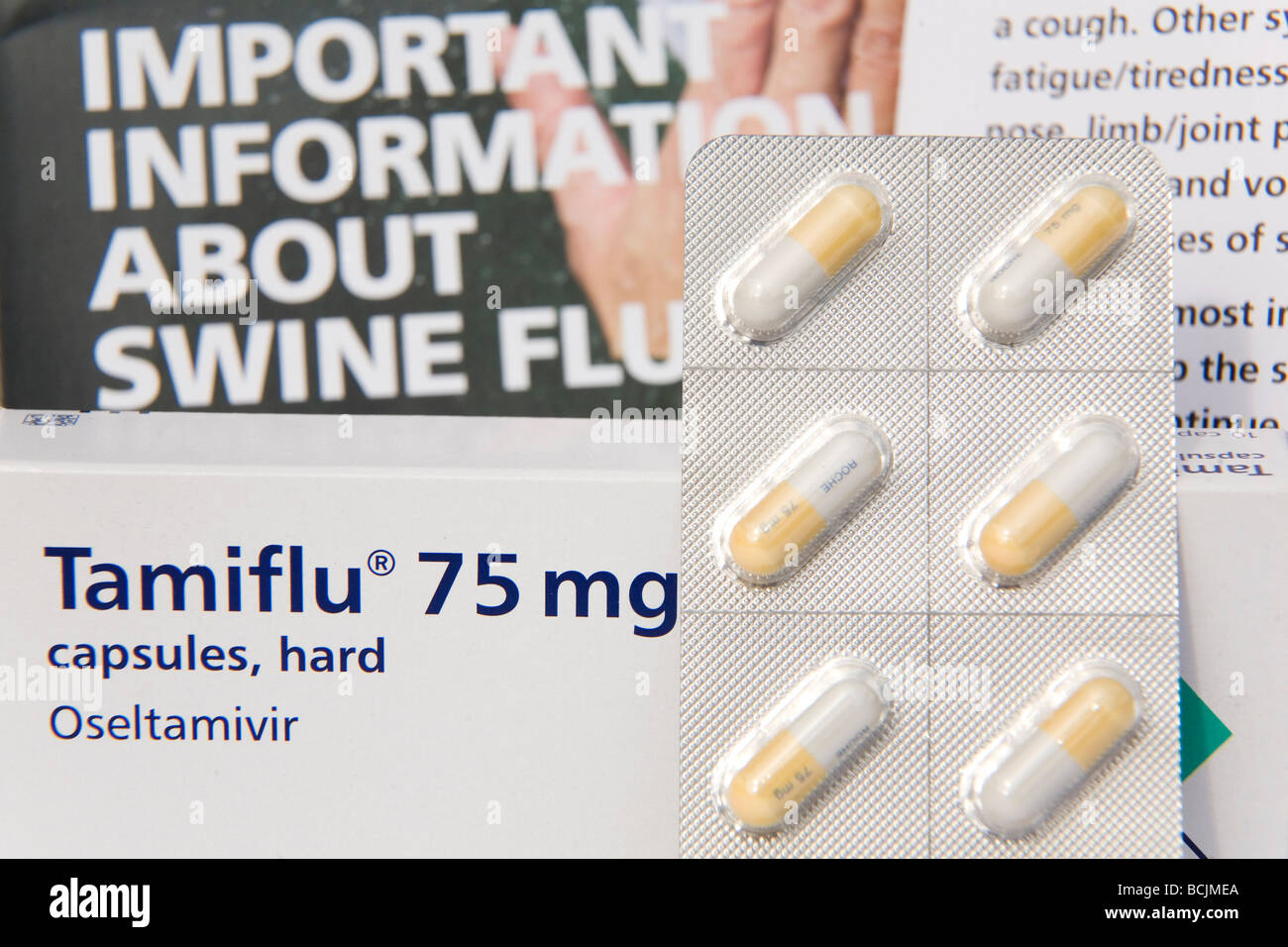 Tamiflu 75 mg tablets , one of the medicines prescribed to people with symptoms of swine flu, along with related literature. Stock Photo