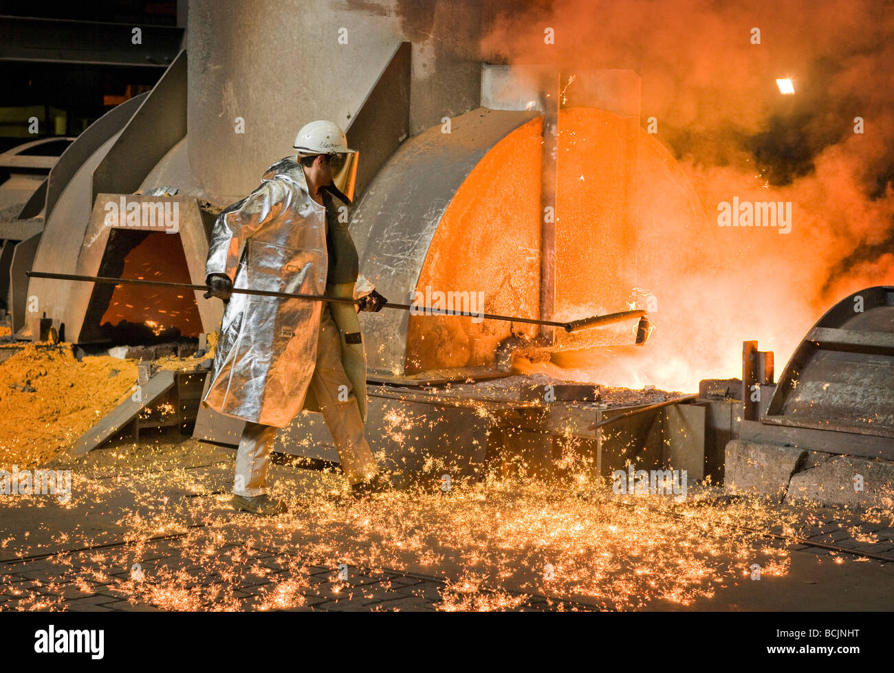 Worker with protective clothes at steel plan Stock Photo