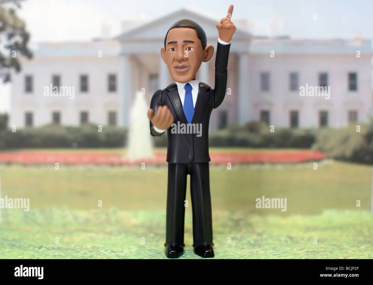 Barack Obama action figure in front of White House Stock Photo