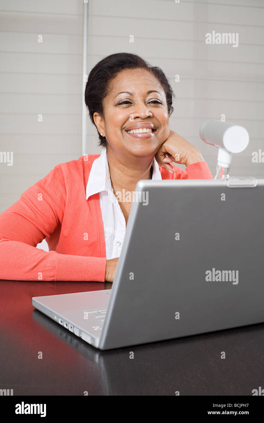 Mature woman using webcam Stock Photo - Alamy