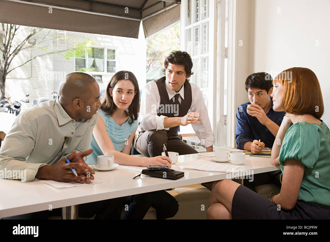 Colleagues meeting in a cafe Stock Photo