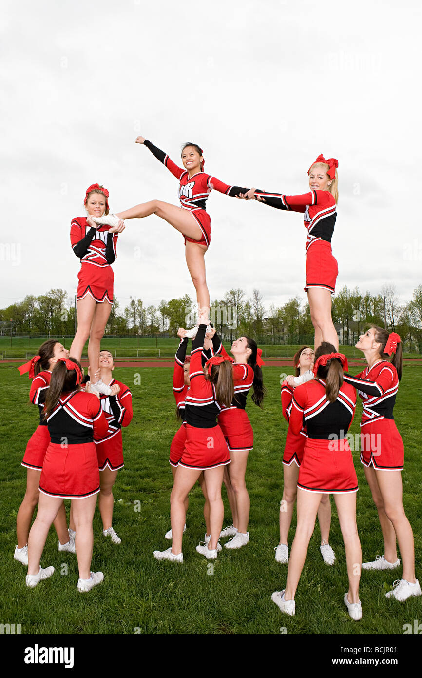 Cheerleaders performing routine Stock Photo Alamy