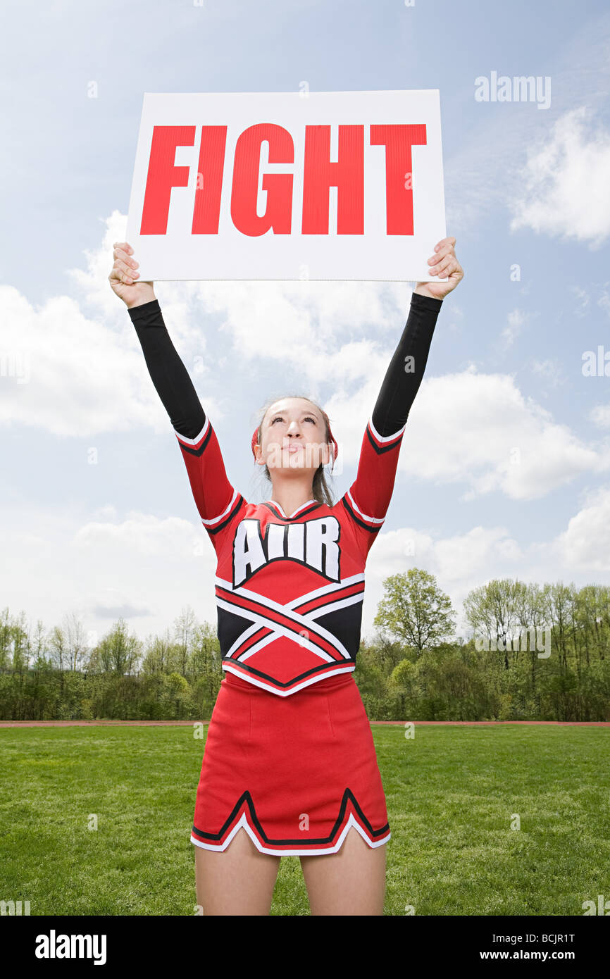 Cheerleader with fight sign Stock Photo