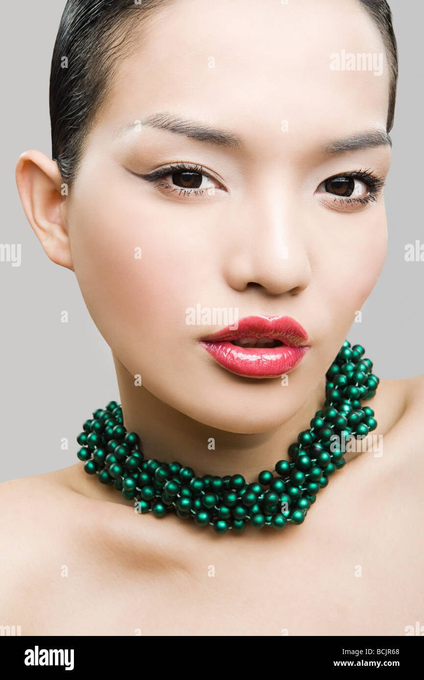 Young woman wearing necklace Stock Photo Alamy