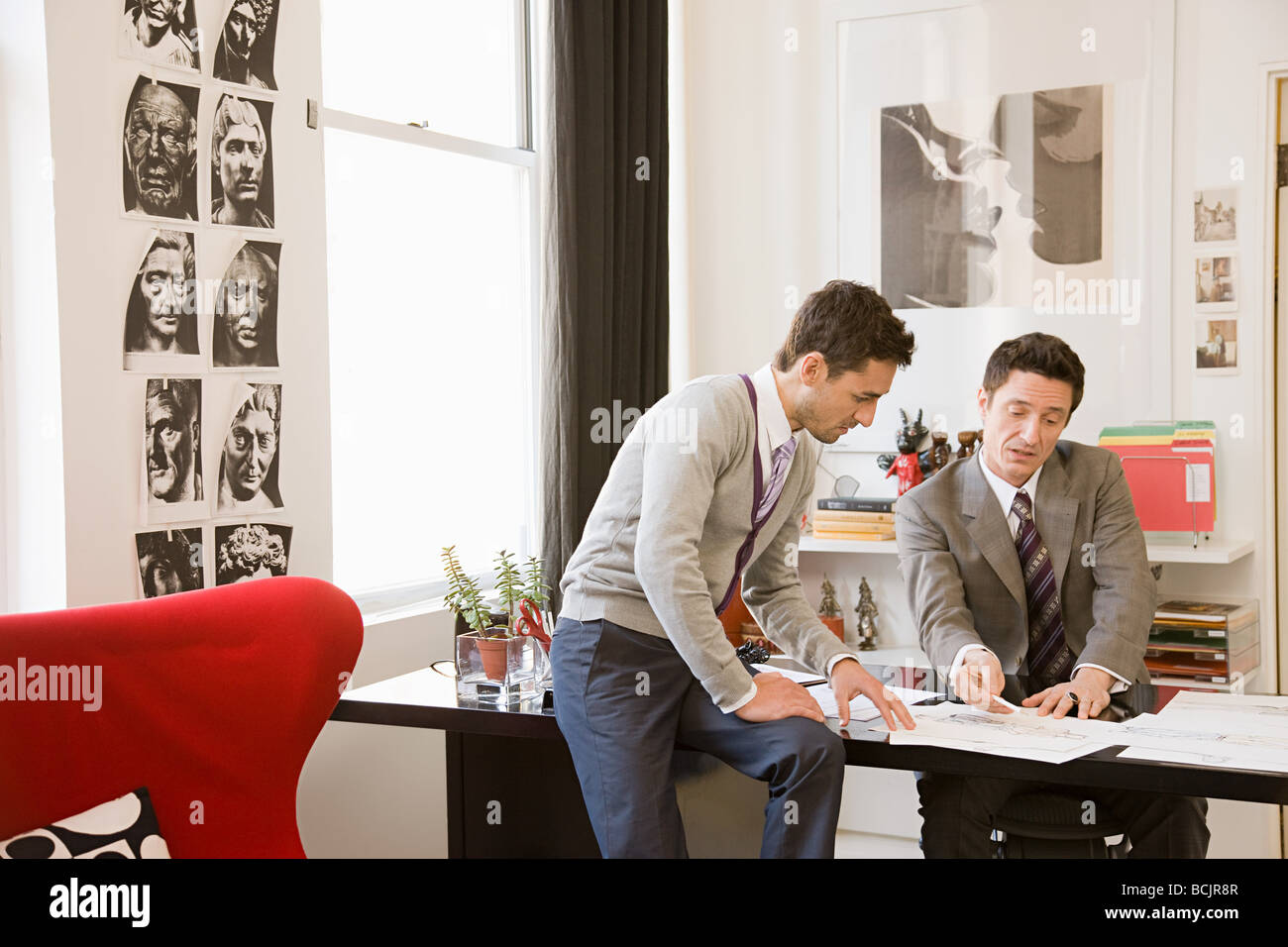 Fashion designers having discussion Stock Photo Alamy