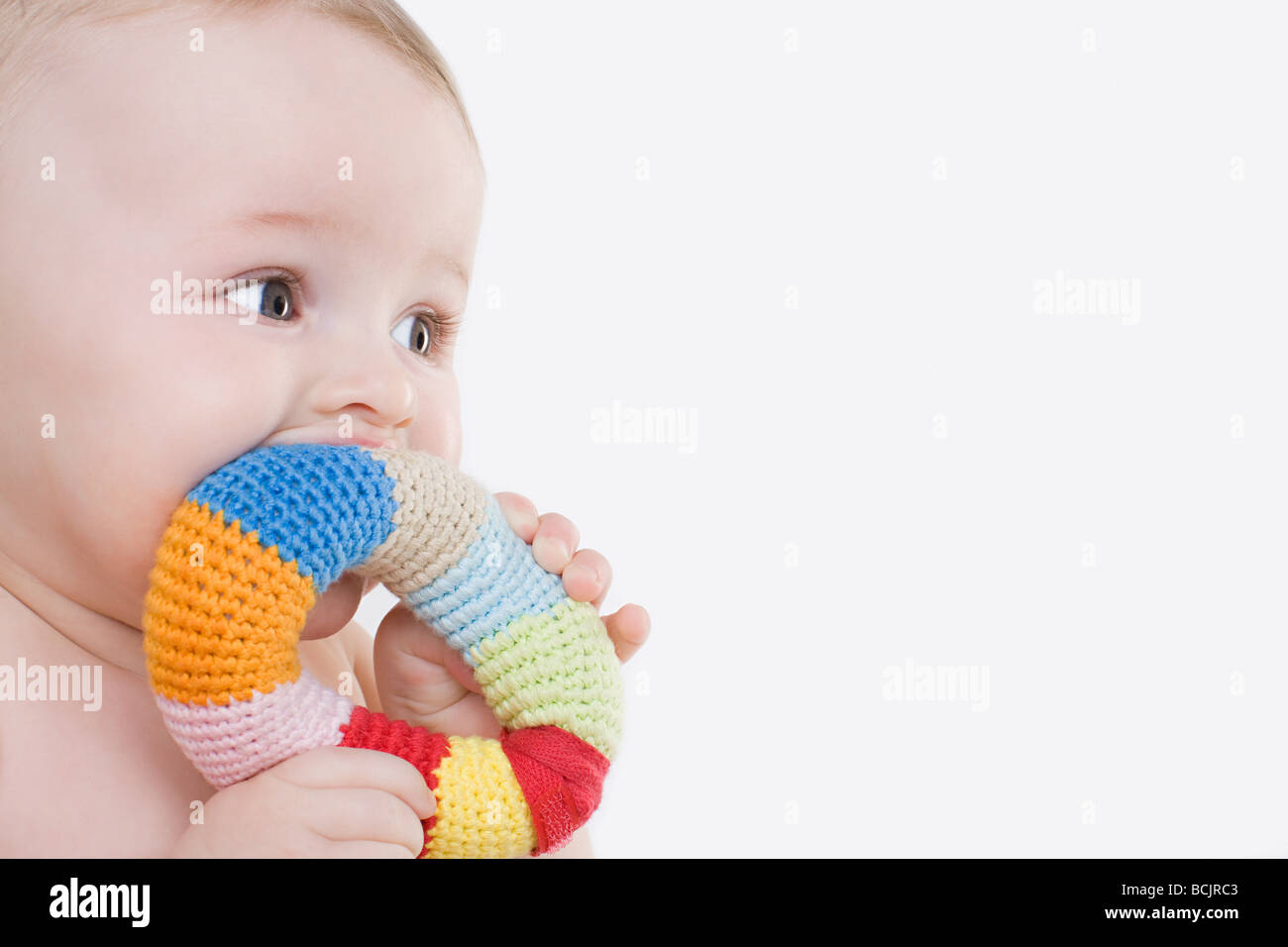 Baby with a teething ring Stock Photo