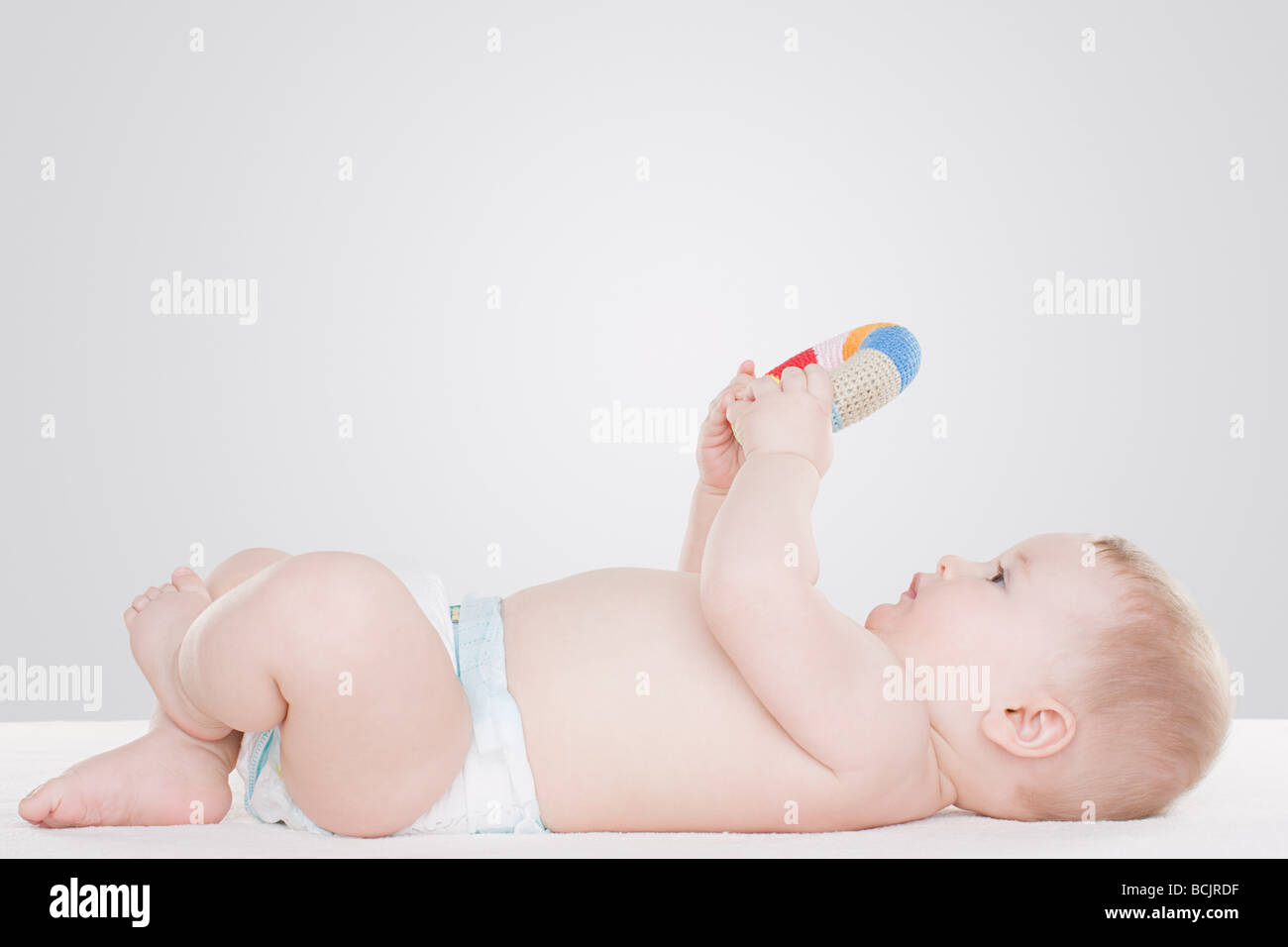 Baby with toy Stock Photo