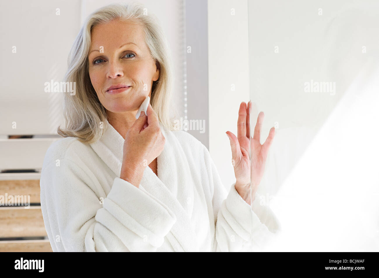 Mature woman cleansing face hi-res stock photography and images - Alamy