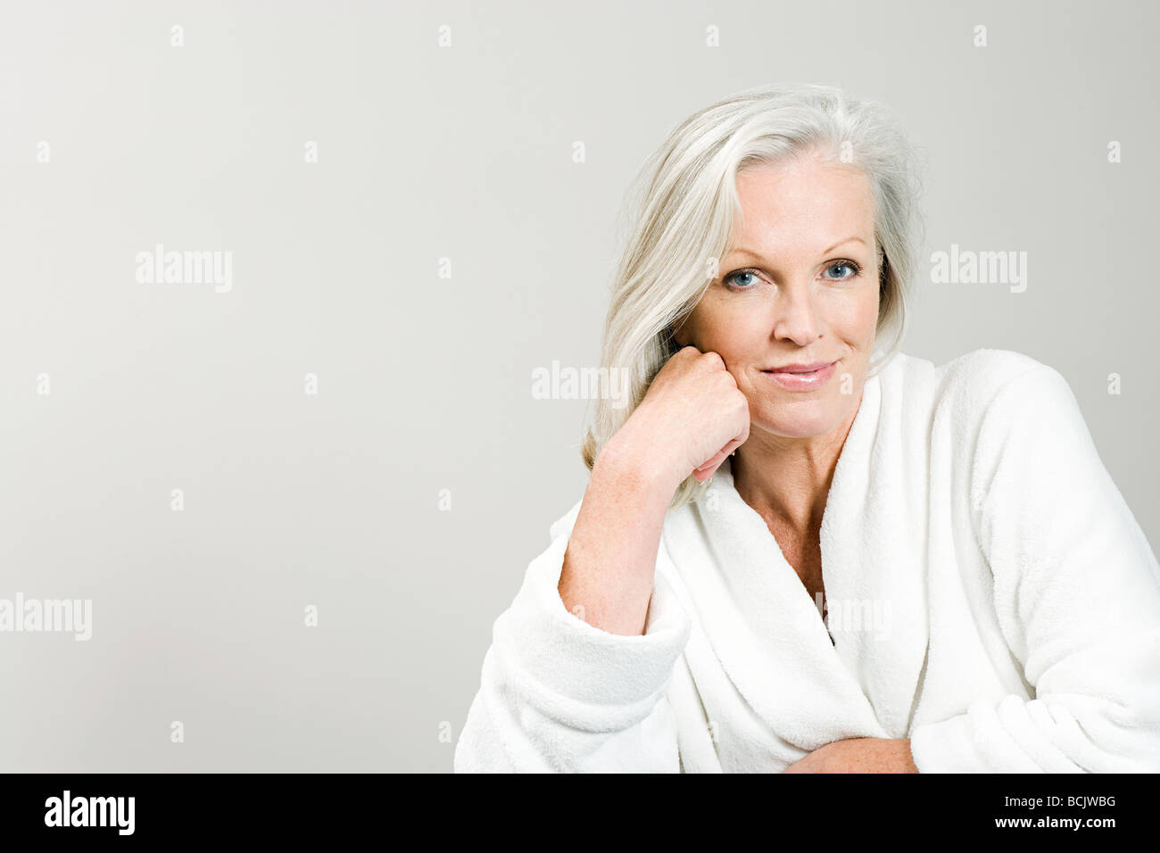 Portrait of middle aged woman wearing bathrobe Stock Photo