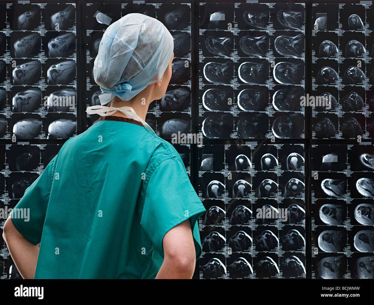 Surgeon looking at x-rays Stock Photo