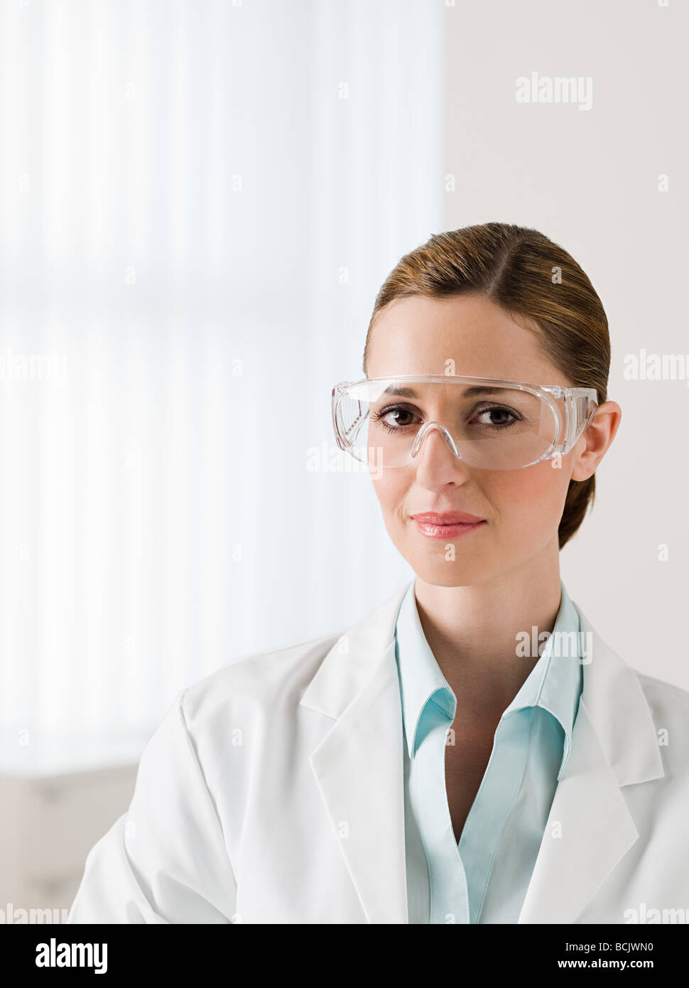 Female scientist wearing safety googles Stock Photo