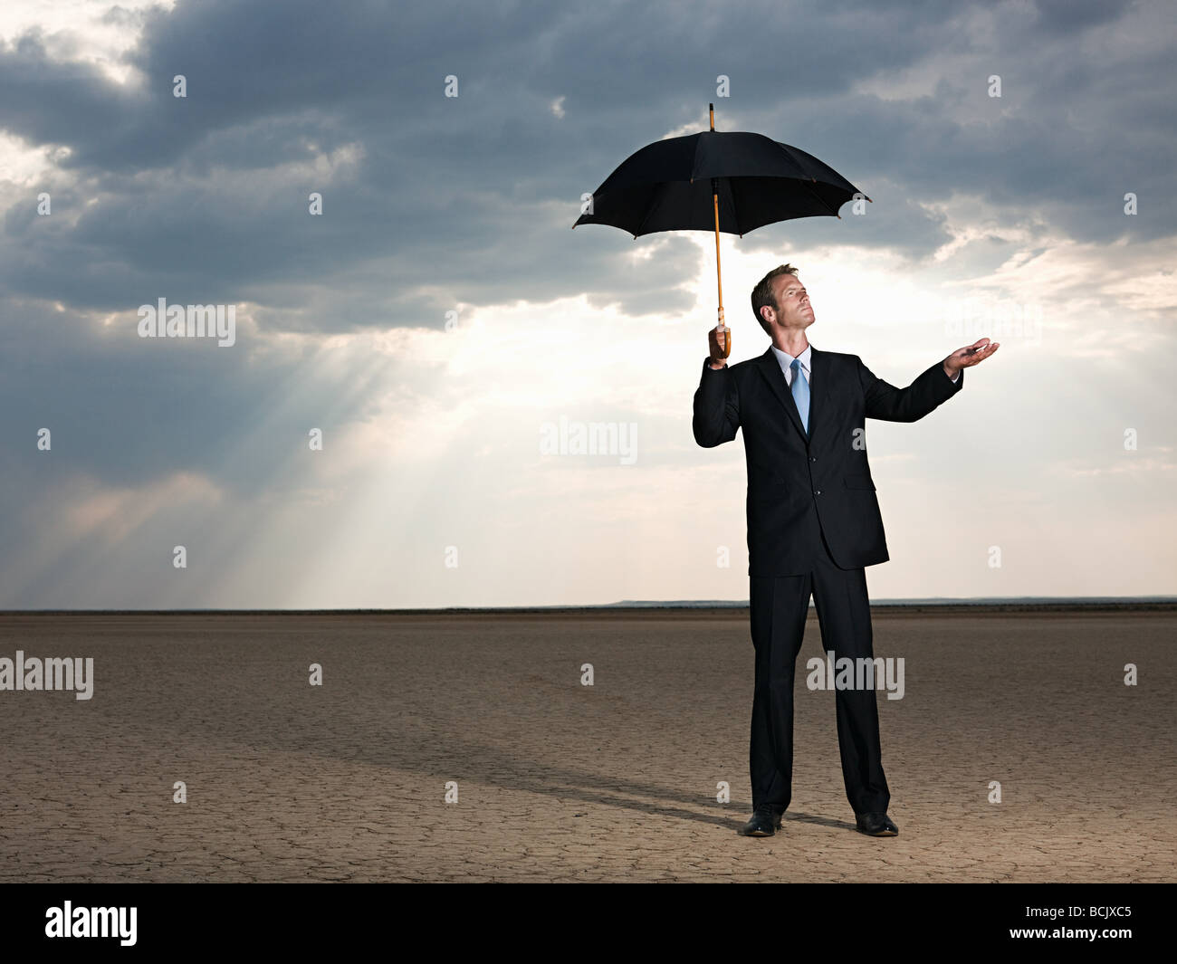 Holding umbrella in the sun hires stock photography and images Alamy